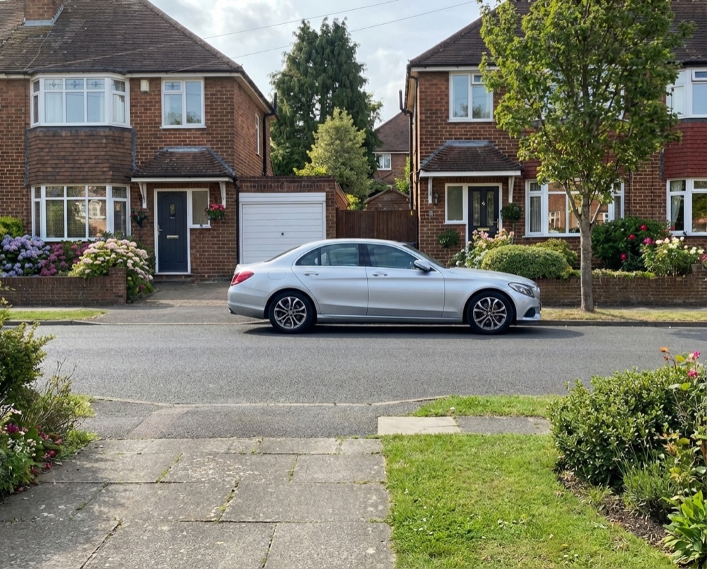 Residential street in Arundel with wheelie bins